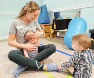 Ms. Karli, a pediatric physical therapist, treats a baby.